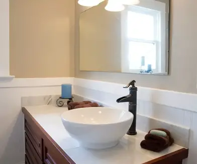 A Bathroom Mirror Be Above Sink, How High Should A Bathroom Cabinet Be Above The Sink